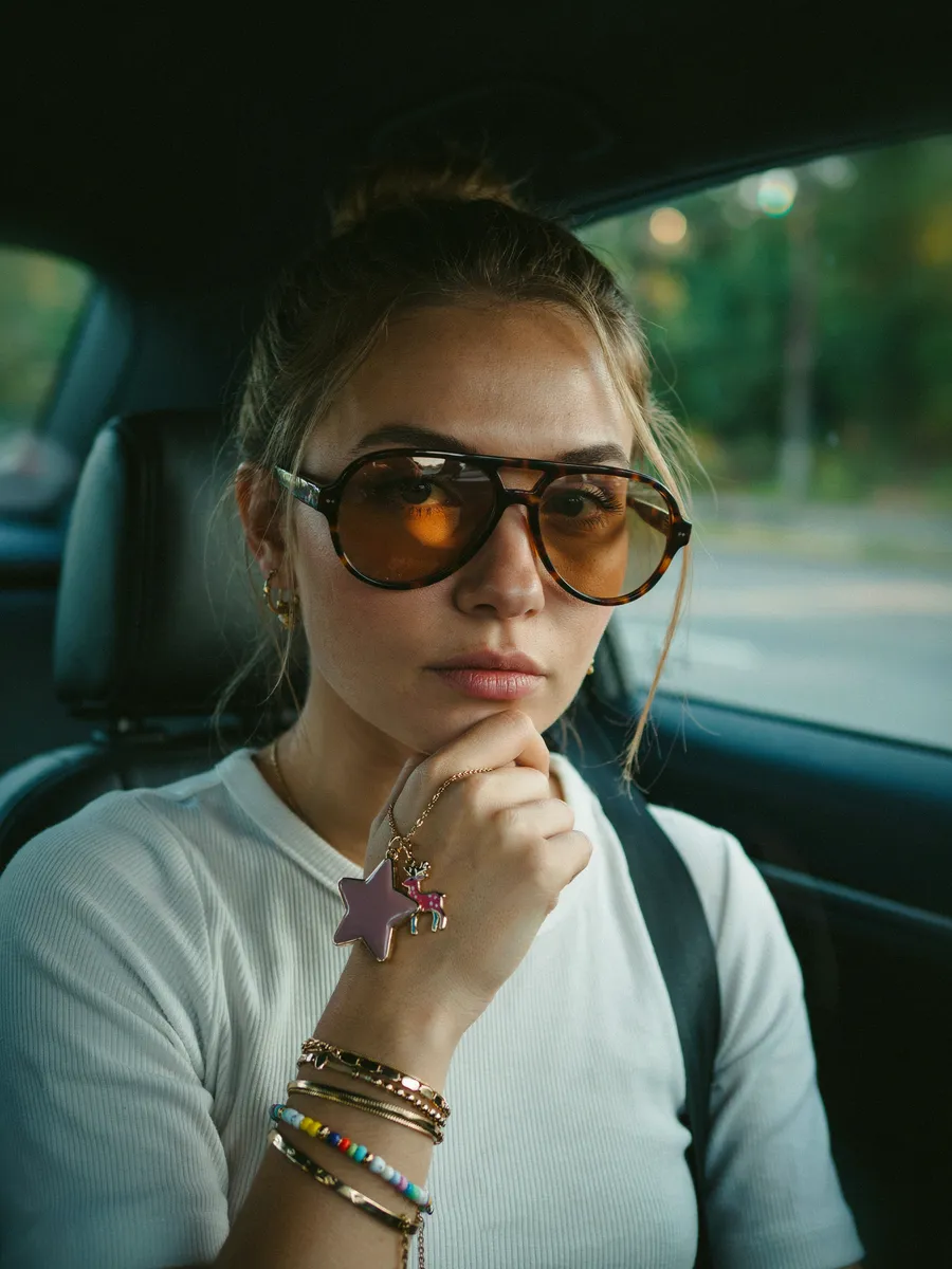 Image made with Ideogram 4.5: Casual close-up portrait of a woman in the front seat